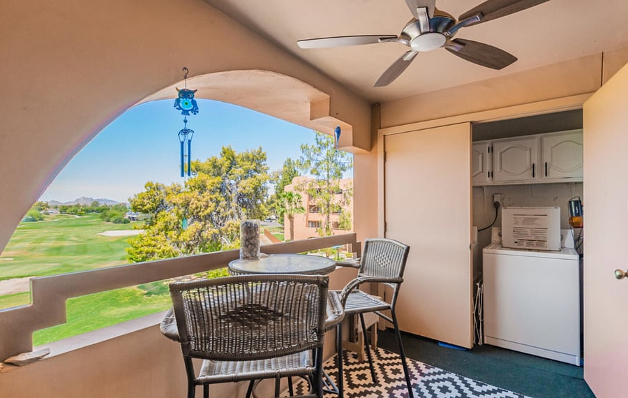View from the patio, washer + dryer and storage