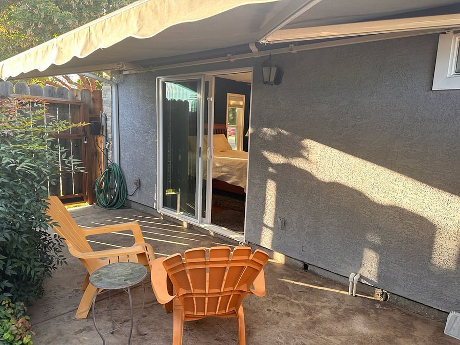 Private patio with access to front yard. Retractable awning