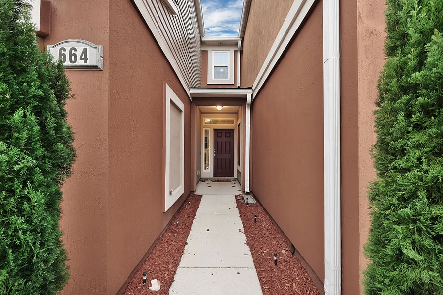 Private walkway with covered porch