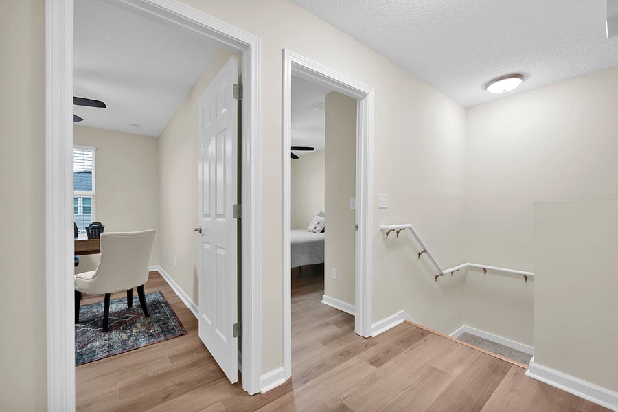 Upstairs landing view into the two secondary bedrooms