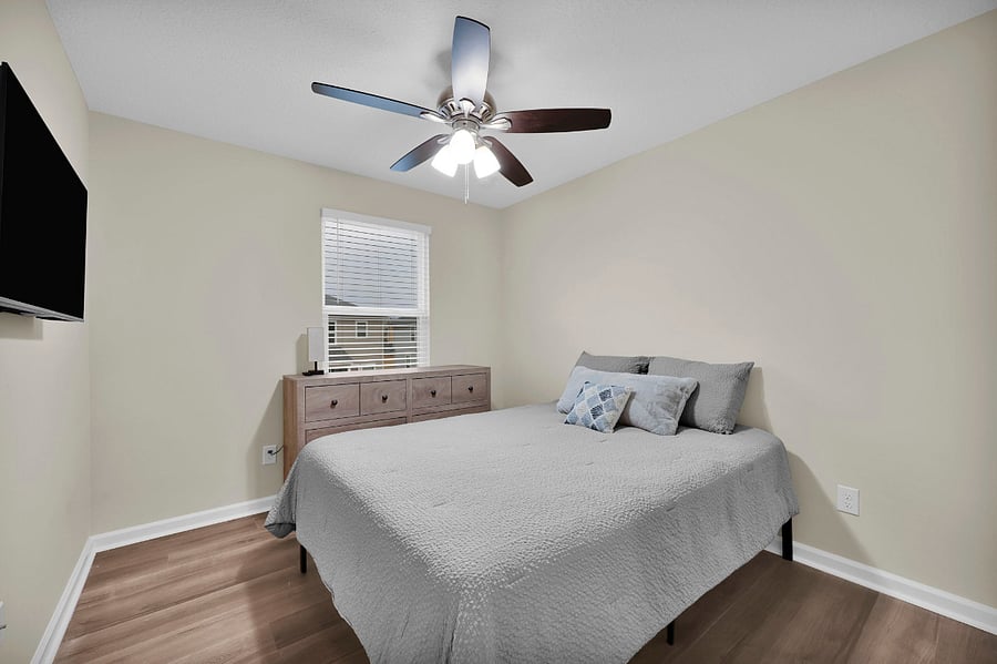 Guest bedroom has a Queen-sized bed and a 40-inch smart TV