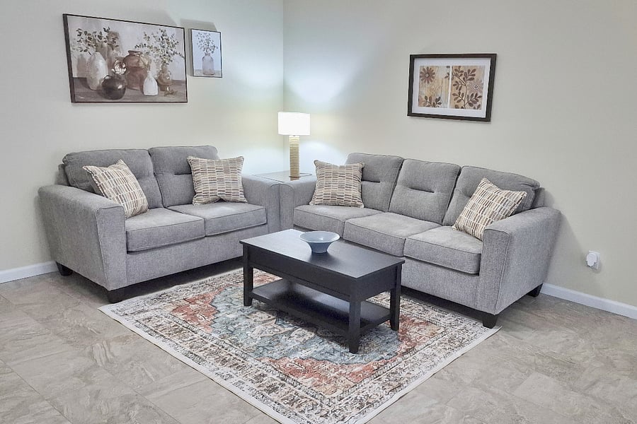 The coffee table lifts to desk height for eating in front of the television or working on the laptop!