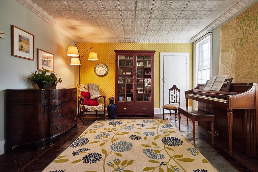 Main floor living room with piano.
