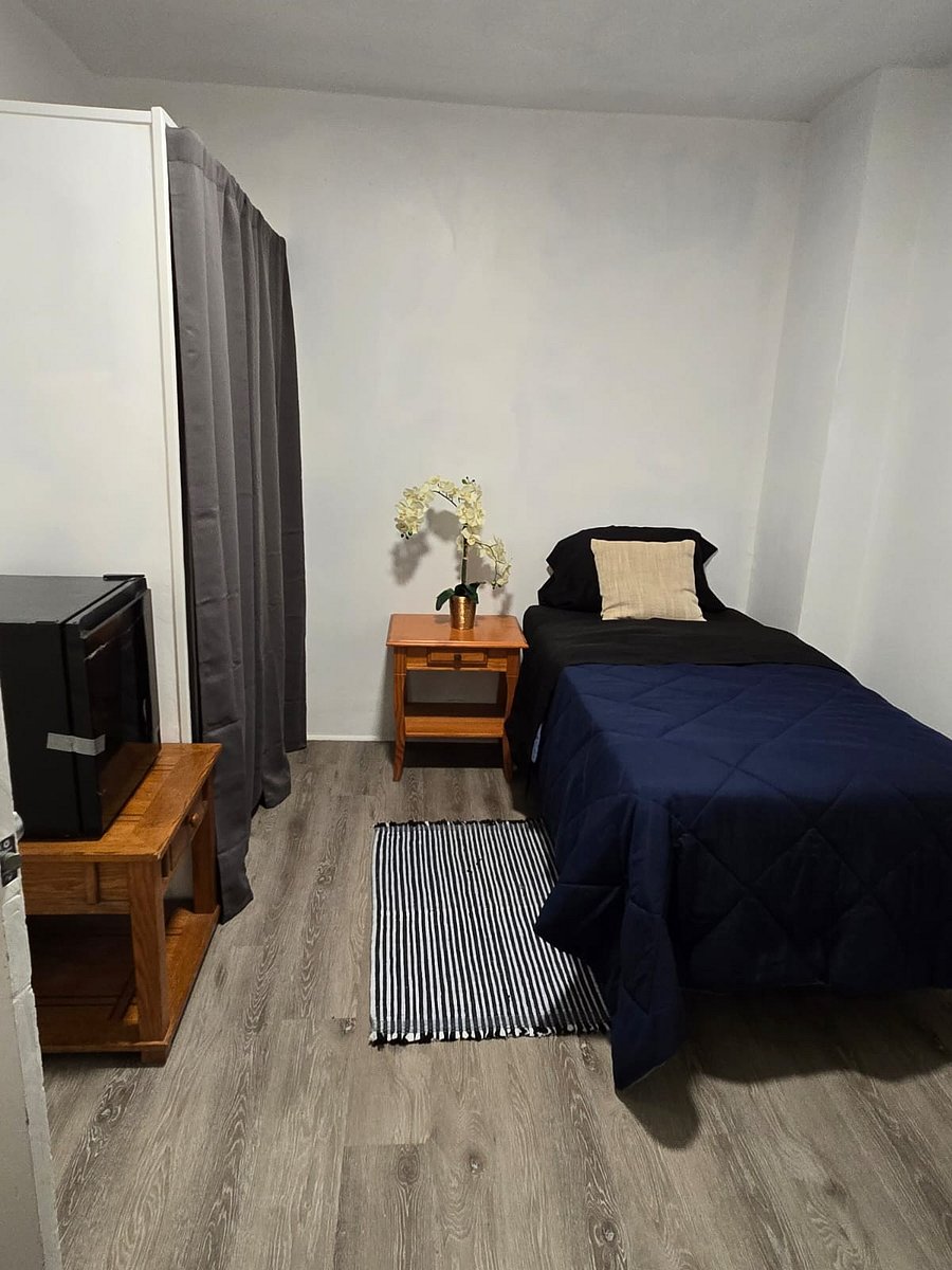 Expect a comfortable bed, night table, chair, mini fridge, and a dedicated workspace. High-speed WiFi and laundry access are included. The rooms are thoughtfully decorated with modern touches and provide a clean, welcoming environmentperfect for relaxing or getting work done.