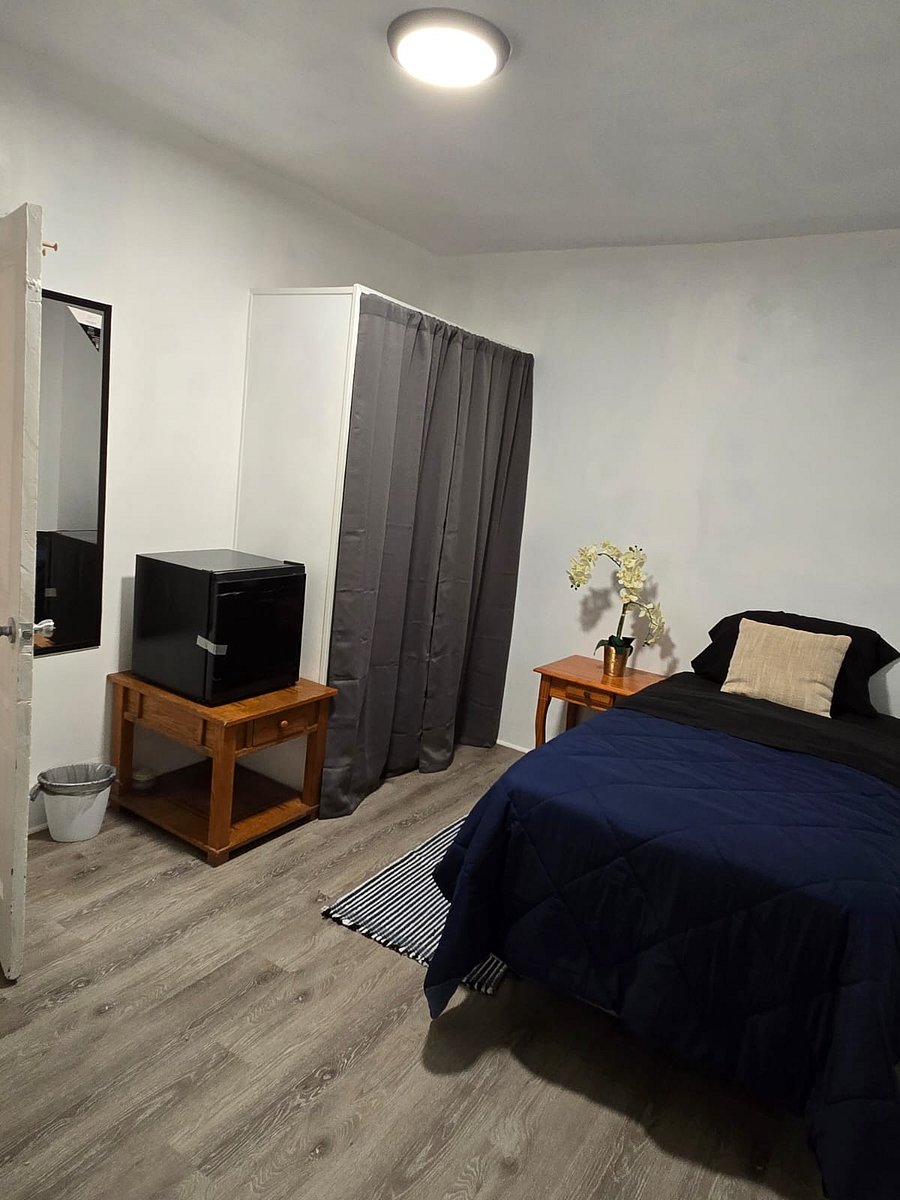 Expect a comfortable bed, night table, chair, mini fridge, and a dedicated workspace. High-speed WiFi and laundry access are included. The rooms are thoughtfully decorated with modern touches and provide a clean, welcoming environmentperfect for relaxing or getting work done.