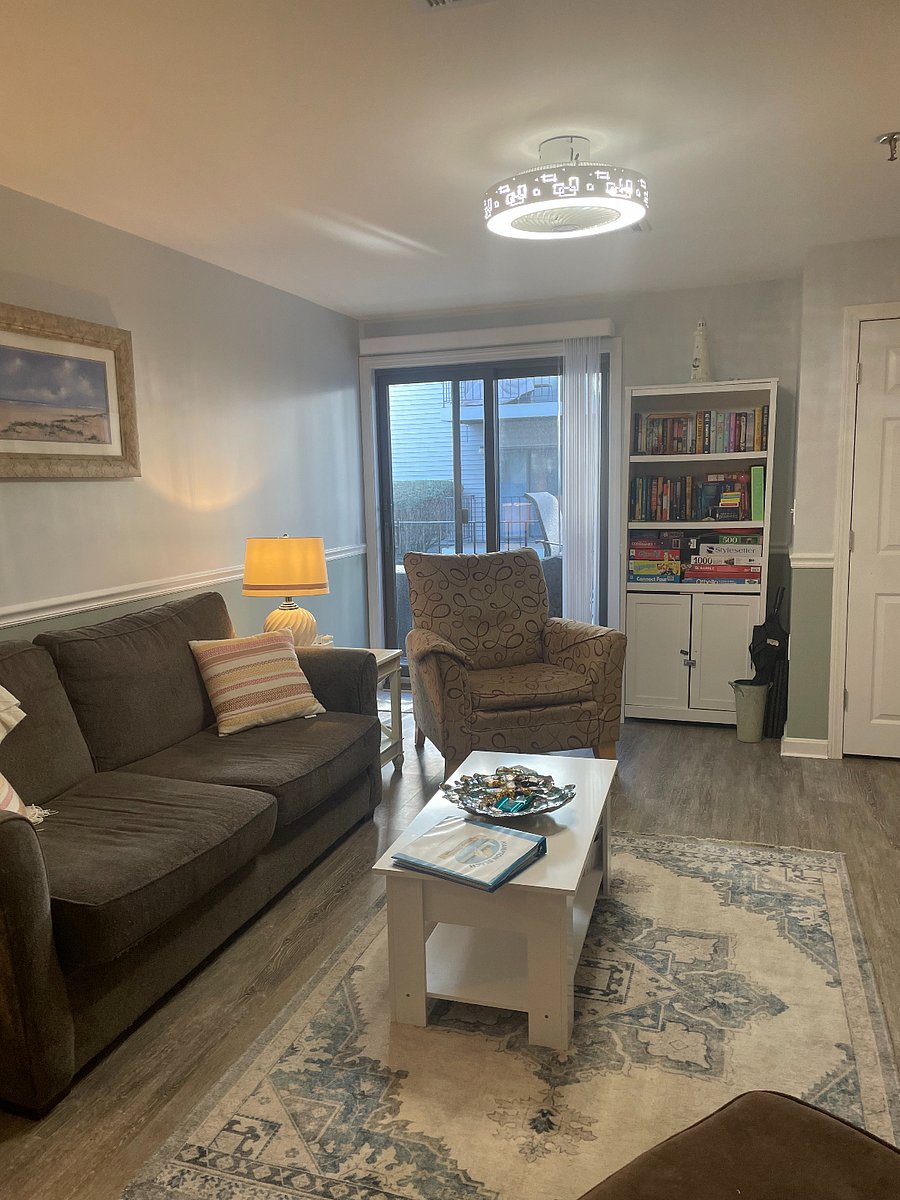 Lliving room with television and cable, dvd player and dvds, games and deck to sit on