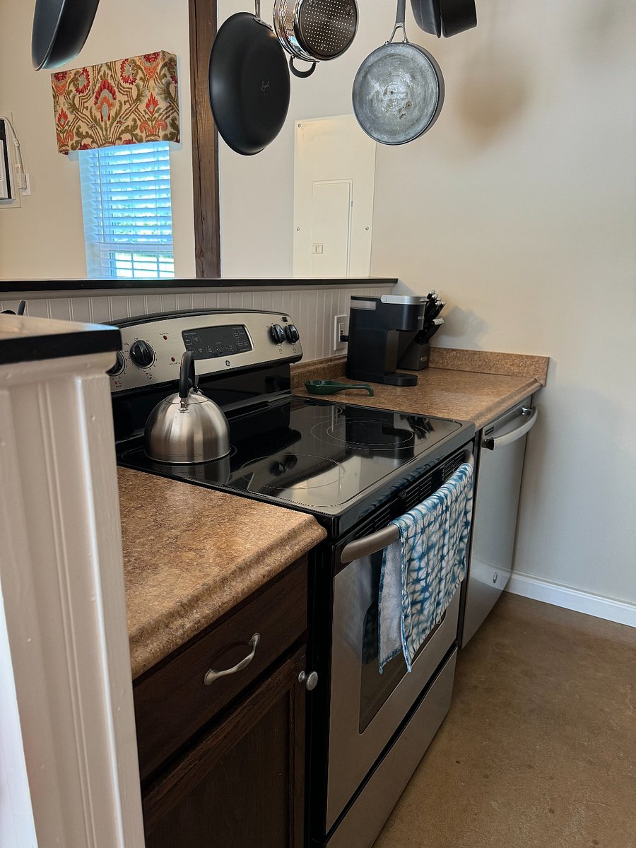 Kitchen w/ smooth top electric range, dish washer and Keurig