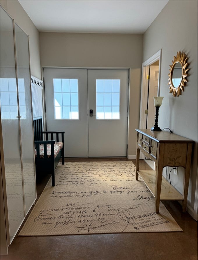 Entryway - spacious and inviting with extra storage in bench seat and entry table.