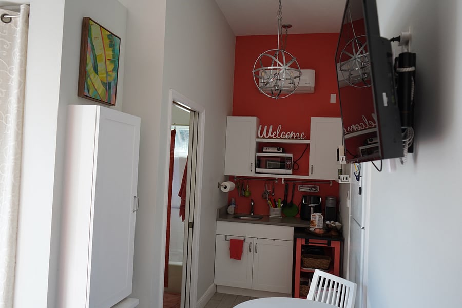 Kitchenette with all essentials, microwave, air fryer, toaster oven and toaster.