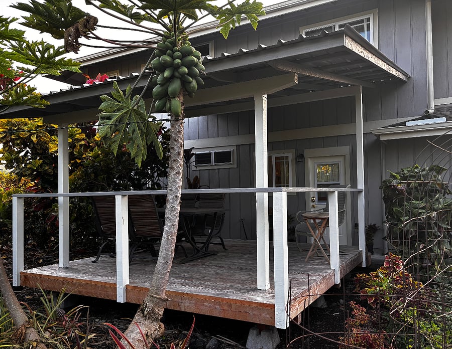 Back lanai with table that seats four and rocker.
