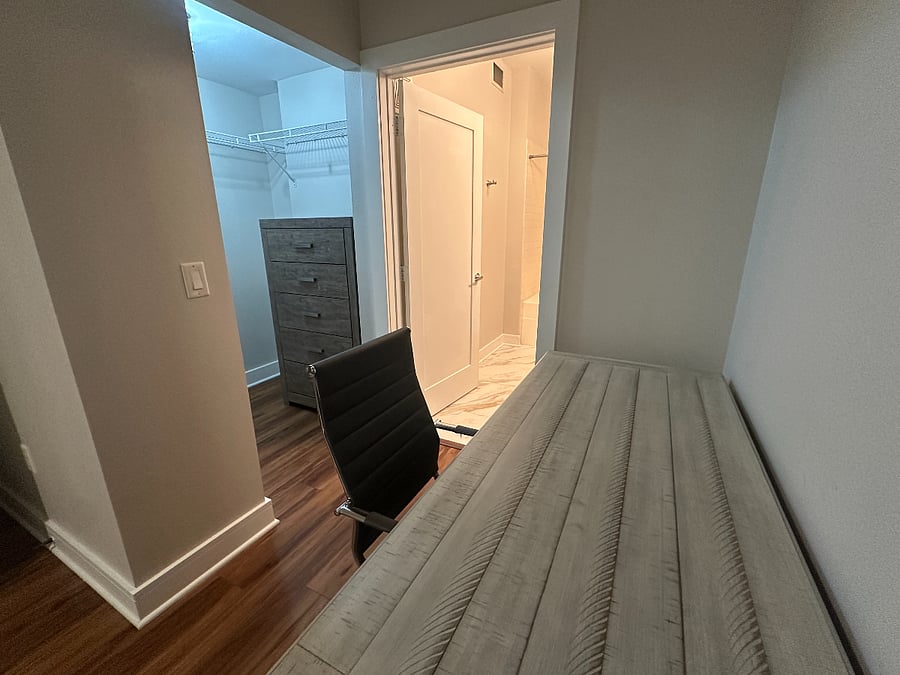 Walk in closet with chest of drawers