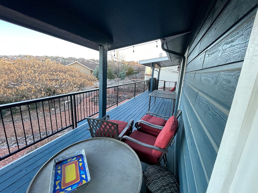 Upstairs huge balcony with patio tables and barbecue awesome view