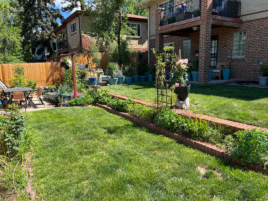 Yard shared by both units. Has outdoor couch and loveseat, side tables, (your own rattan chairs and table at the front door of this unit) and a full outdoor dining table and chairs and bbq for property occupants. Yard service is included.