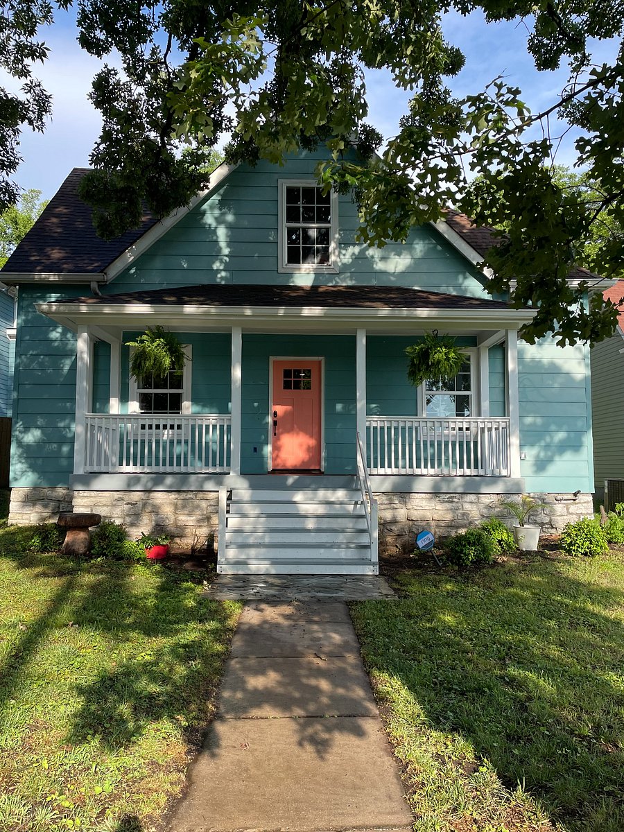 Front exterior. There is a small gas BBQ and a fireplace out front in my house you can use anytime. Several chairs out there. Your room is the bottom right window in this photo.