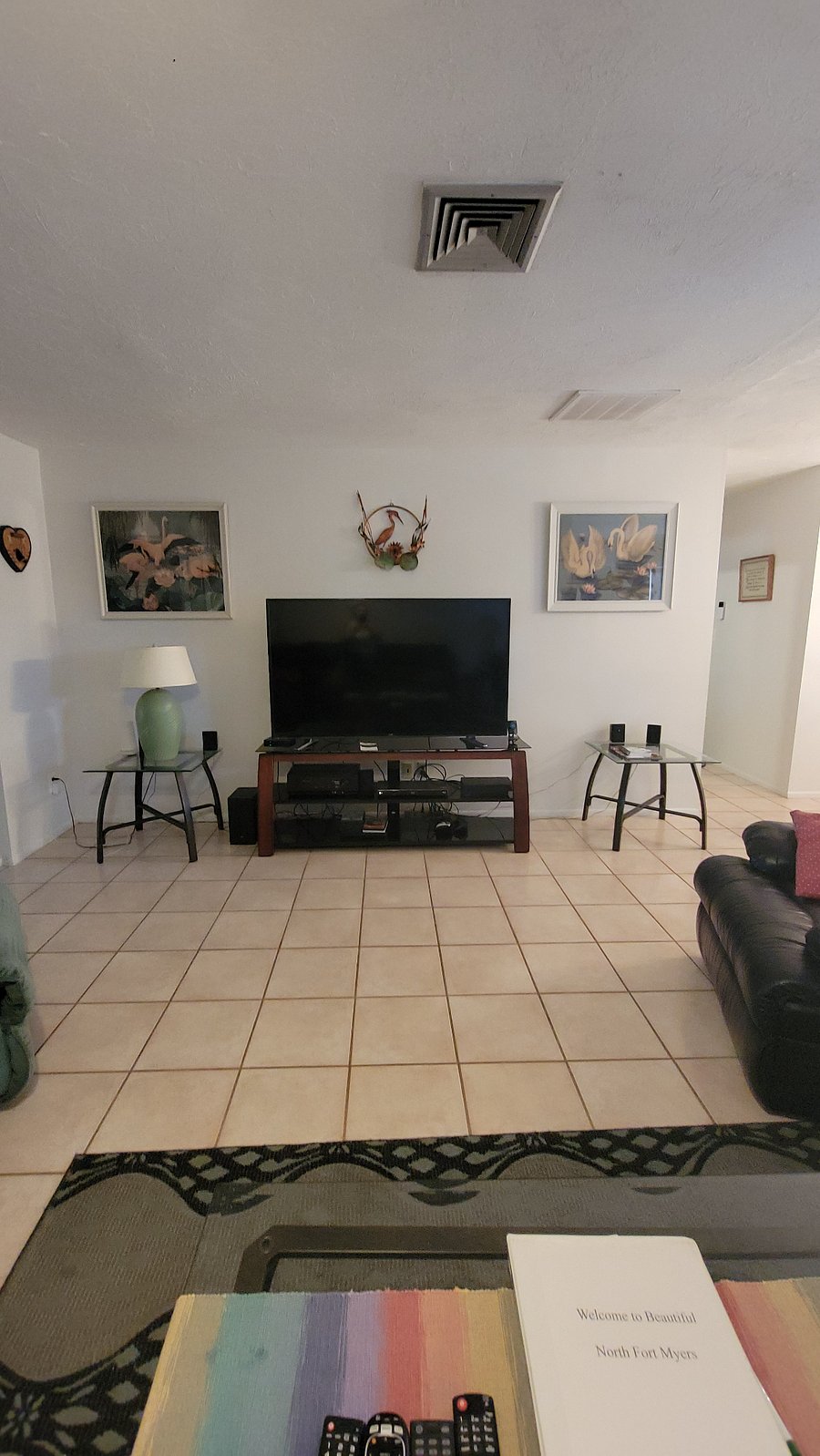 LR with 60" TV and entertainment center.