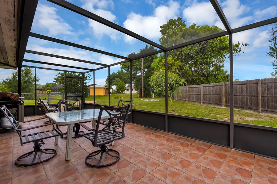 Lanai with table, chairs, BBQ grill and lovely view