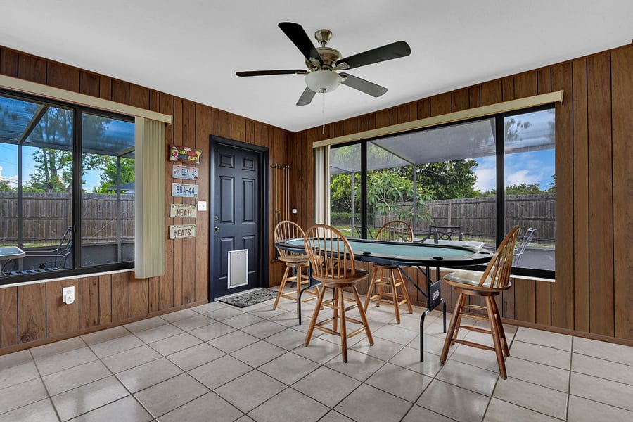 Entertainment Room with poker table and pool sticks