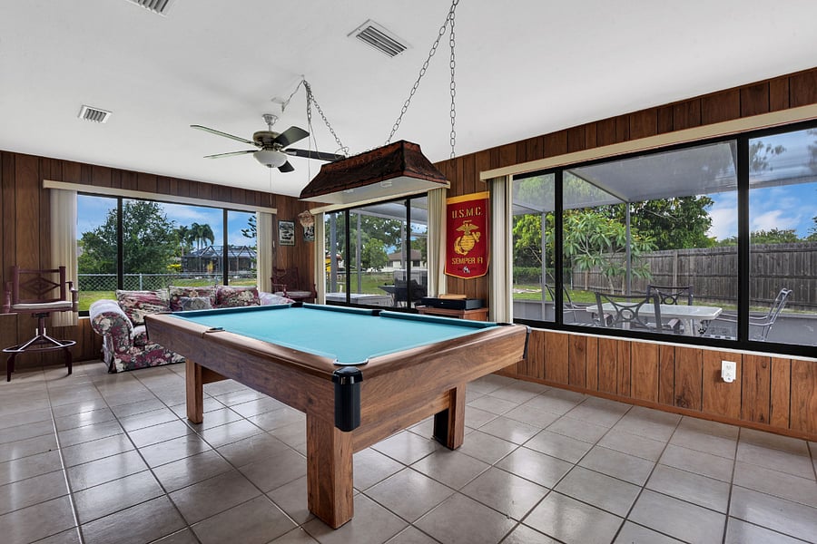 Entertainment Room with pool table, chairs and couch with nice view