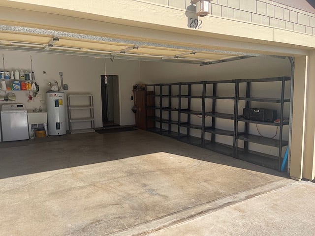 Two car garage with wall of storage.