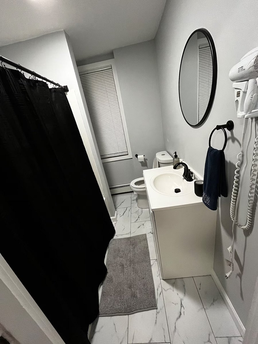 Full size bathroom with bathtub and hair dryer