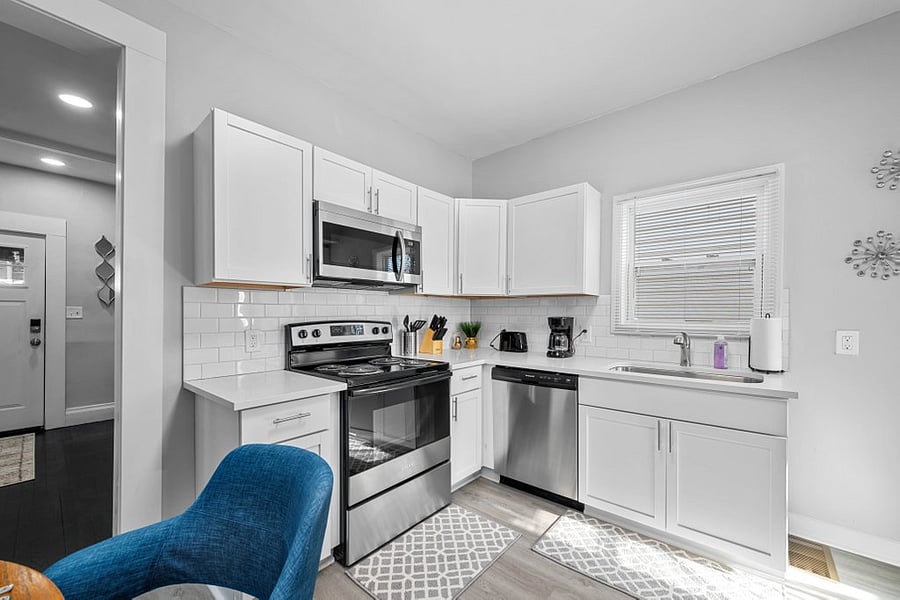 Fabulous kitchen with new cabinets, stainless appliances and tiled backsplash.