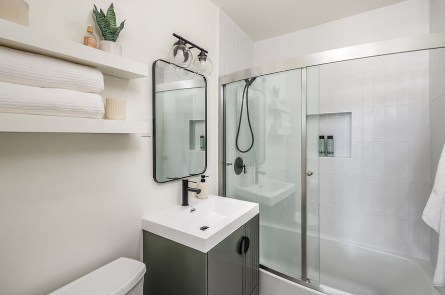 Full washroom with walk in shower and soaking tub