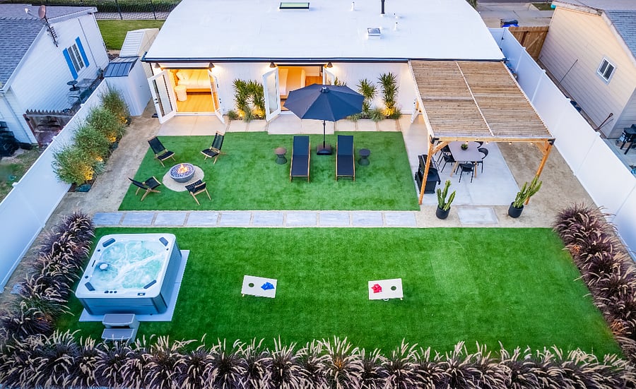 Fully enclosed private large backyard with fire pit and hot tub