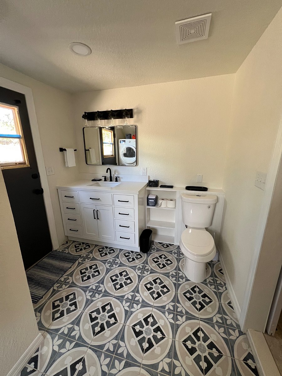 Master bathroom with many drawers for storage.