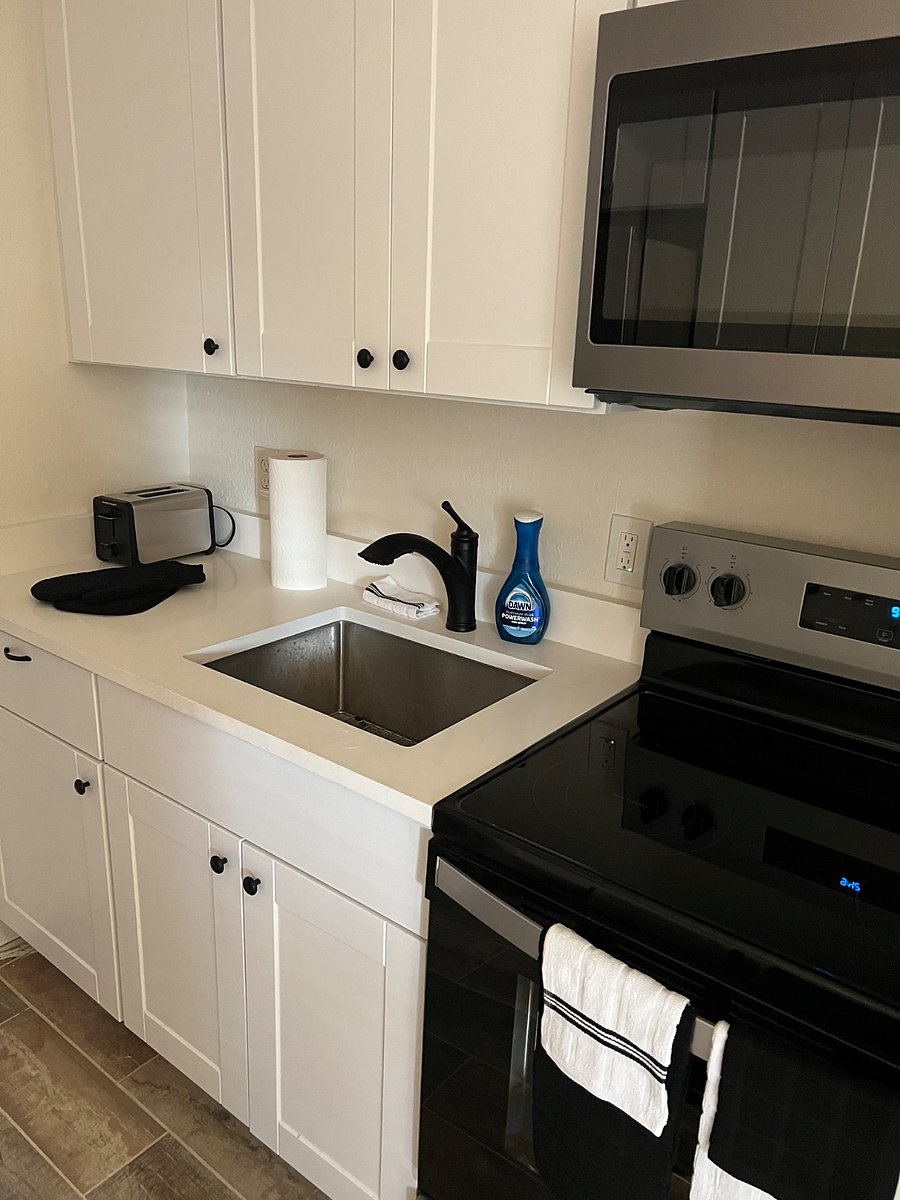 Kitchen sink with spray handle, toaster, paper towels will be mounted under cabinet to give more counter space, drying rack under sink.