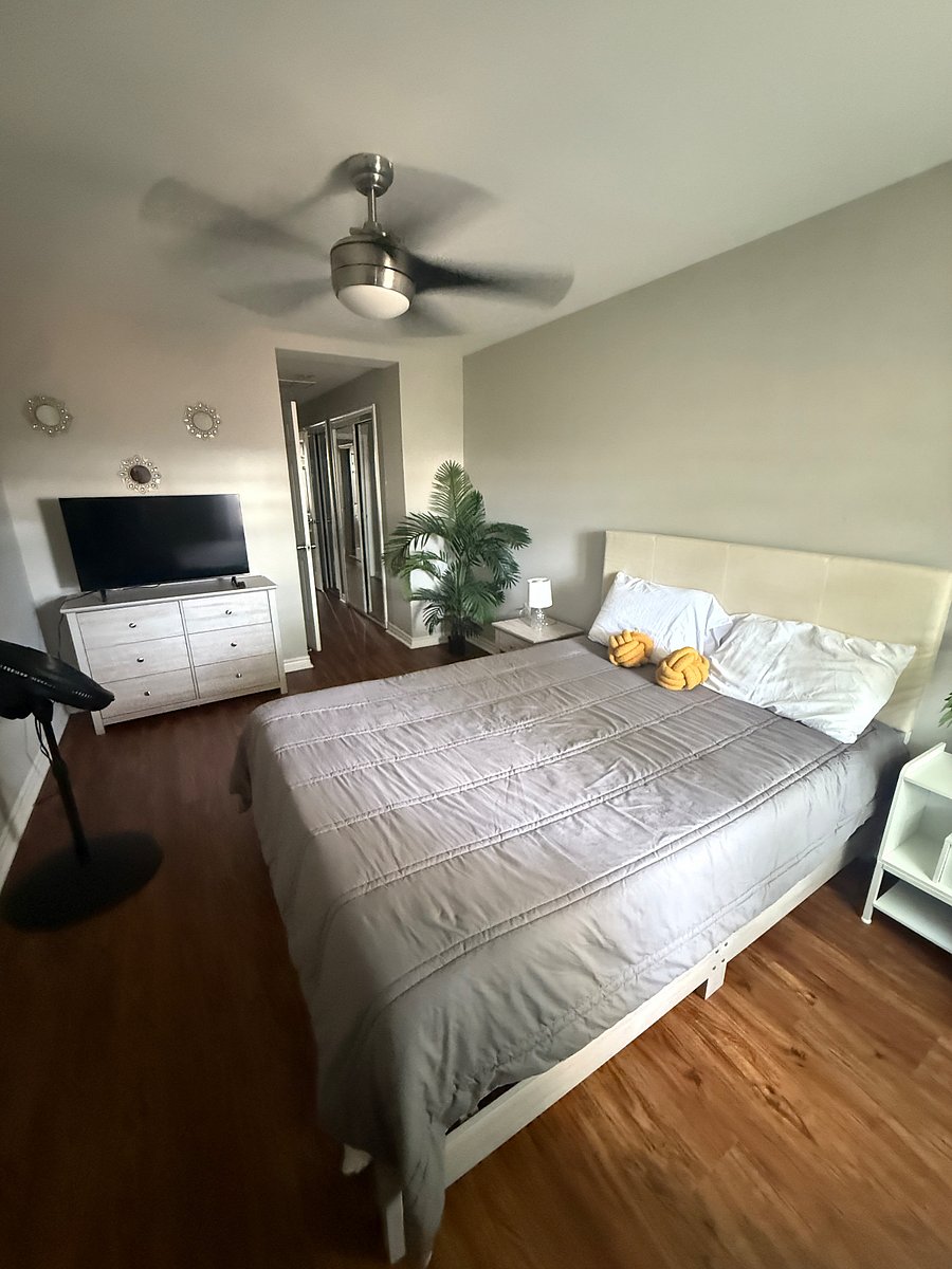 Master Bedroom - queen bed with smart tv. In-suite, master bathroom with jaccuzi-tub. Private balcony. 