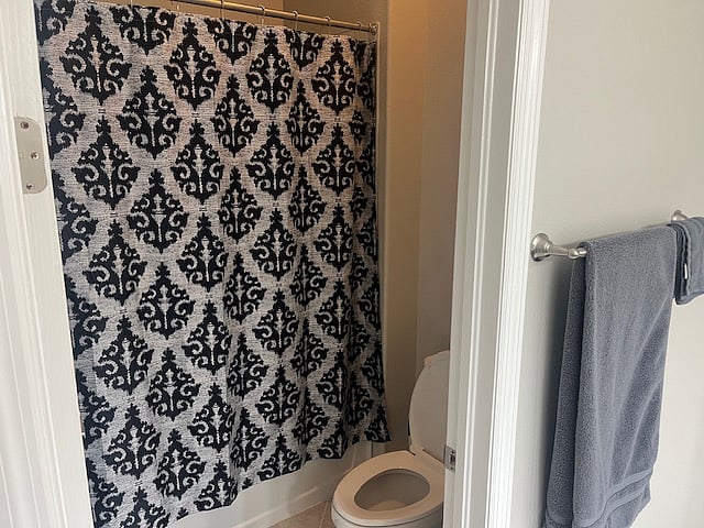Shower and toilet in jack n Jill bathroom first bedroom