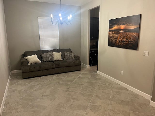 Large open space dining (unused dining area) room with pull out sofa bed adjoining kitchen - no door