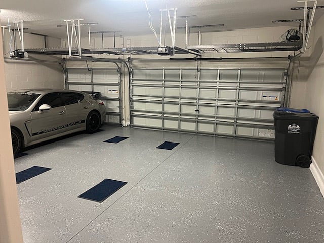 3- car garage with 2 spaces remaining.  The car is owners and off limits.