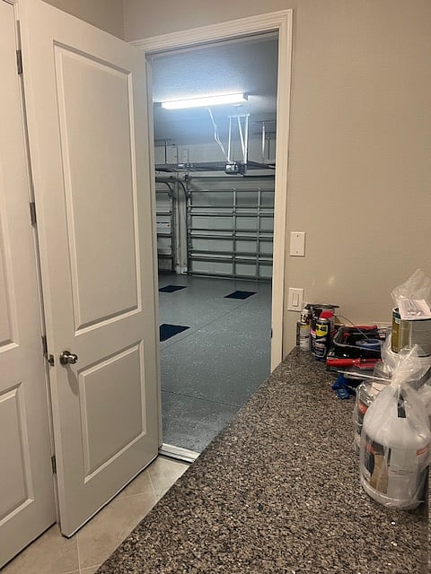 short hall leading to 3-car garage