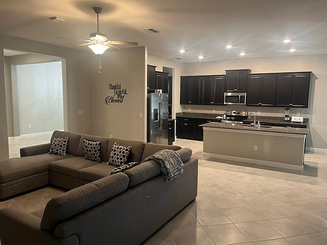 Great open concept so those working in kitchen can still see TV and be part of conversations!