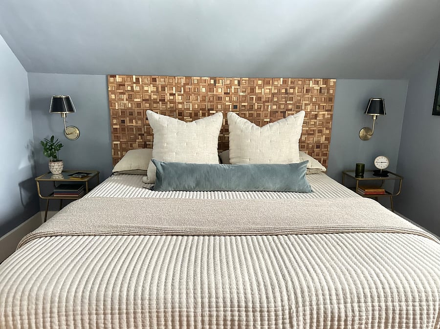 Main bedroom has kind size bed, dresser and large dresser and a closet with extra storage.