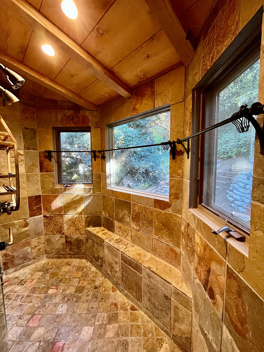 Large stone shower with double entrance in primary en-suite