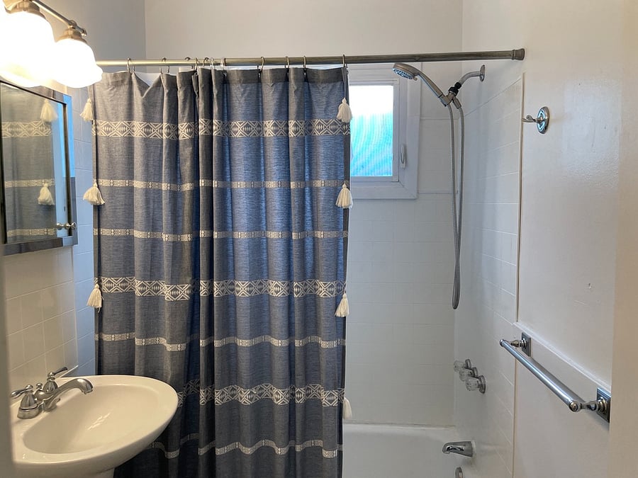 Shower over tub in bathroom