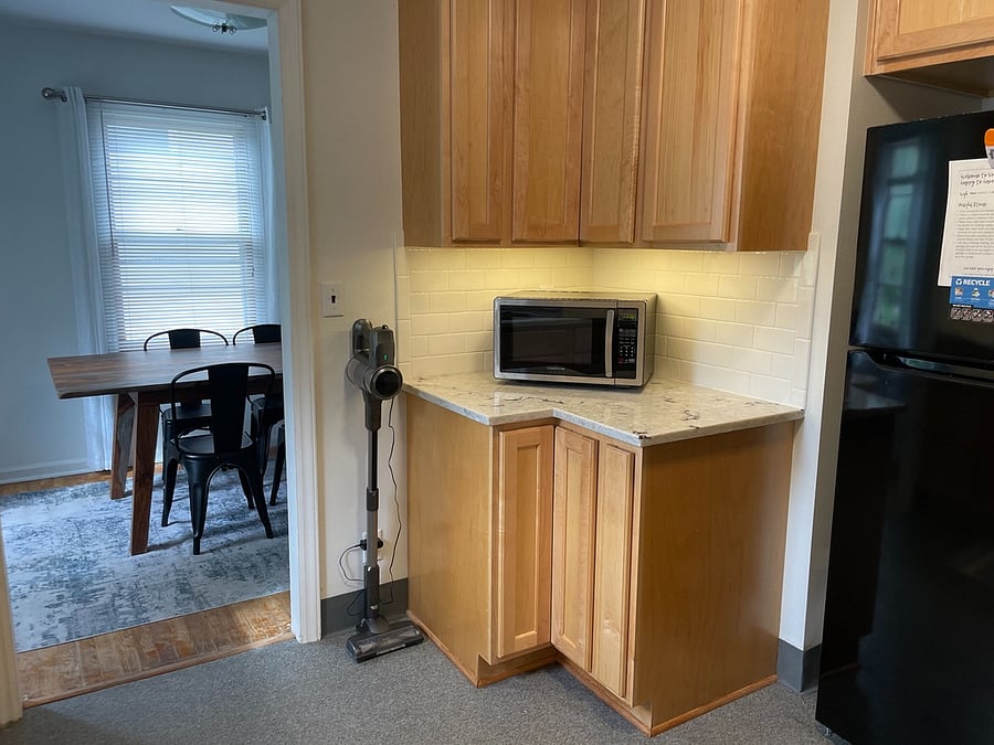 Kitchen with microwave and full-size fridge