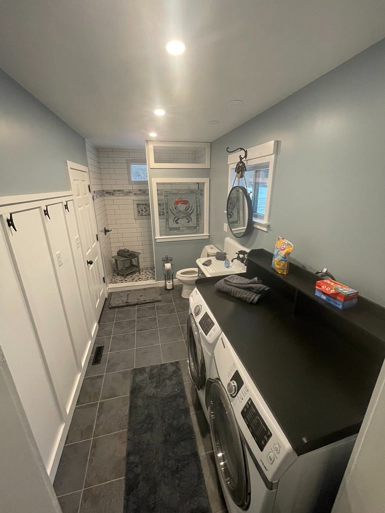 Bathroom/Laundry with large walk in shower. This view from den, which is not pictured (currently holds last of contstruction supplies/tools)
