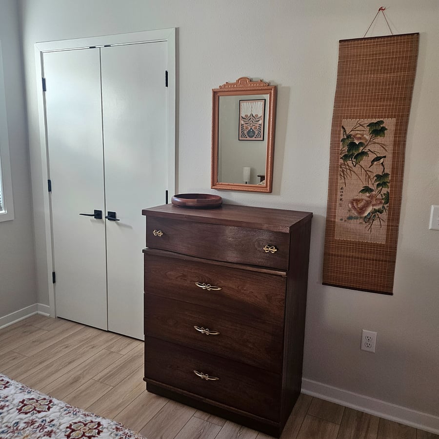 Dresser, mirror and closet space. Full length mirror in closet