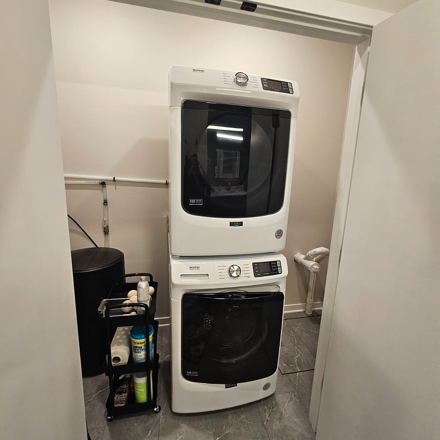 In unit washer and dryer. Dyson cordless vacuum, swiffer mop and extra cleaning supplies.
Water softener and utility closet