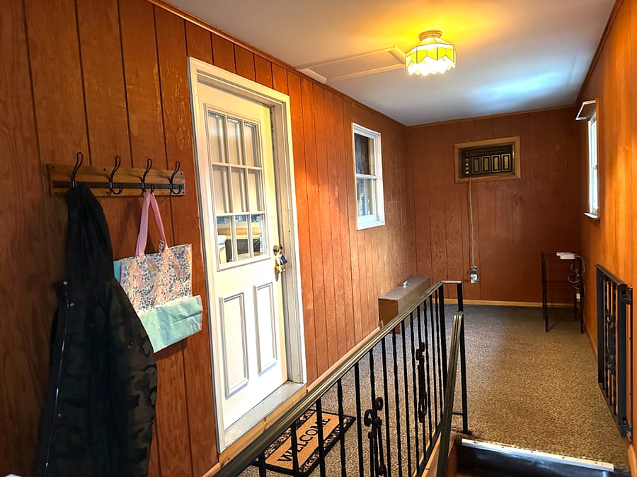 Rear stairs into unit - tenant can use this mudroom/storage area