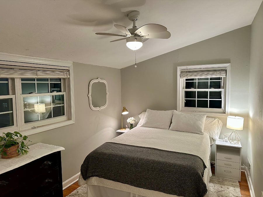 Master bedroom with queen bed, nightstands with usb ports, 2 lamps, ceiling fan, blinds.