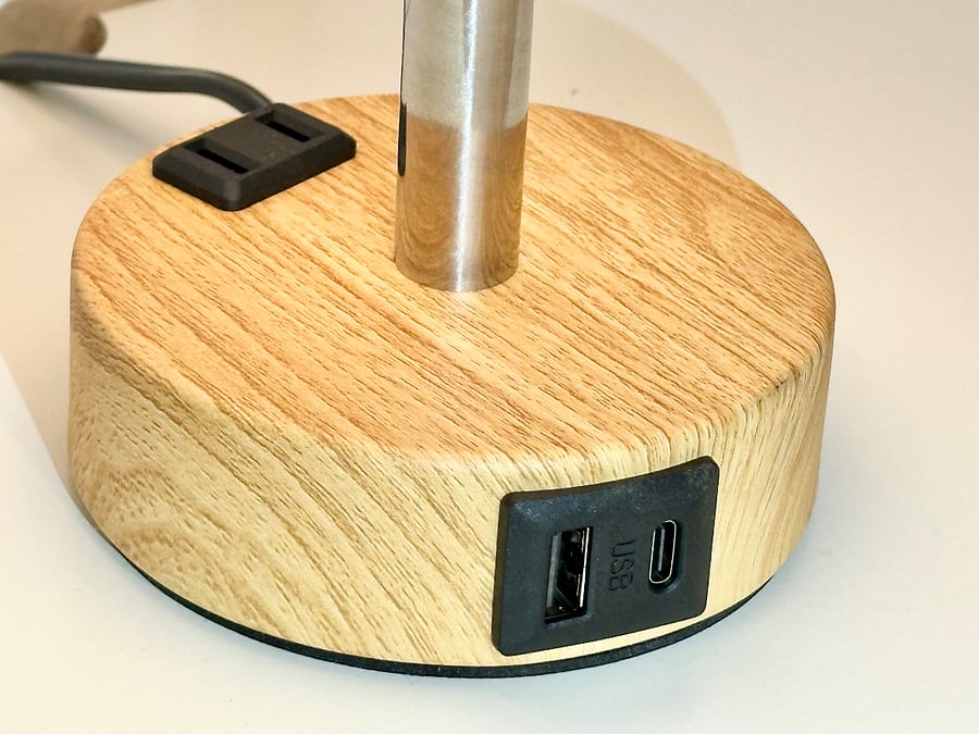 Dimmable touch lamp on the headrest with USB A + C charging and AC outlet for easy charging throughout the night, making it perfect for a restful stay with everything you need at hand. 