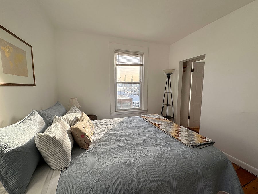 The first bedroom has harbor views from both windows and direct access to the bathroom.