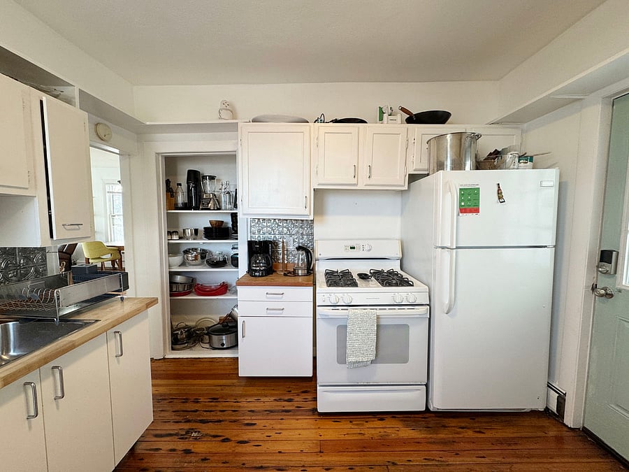 Cozy kitchen with butcher block counters and beautiful harbor views