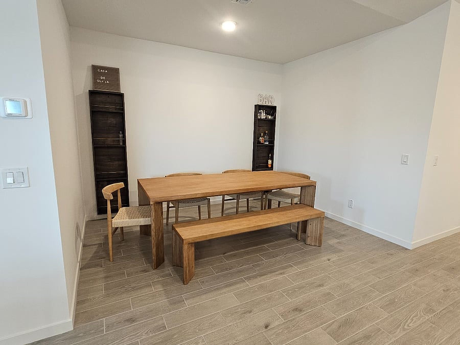 Dinning space that opens up to the kitchen with large dining table.