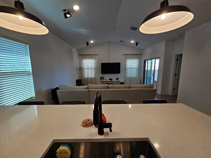 Kitchen faces living room perfect while doing dishes.