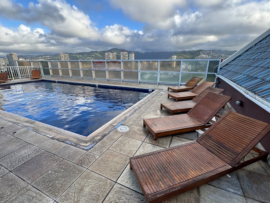 Rooftop pool with lounge chairs